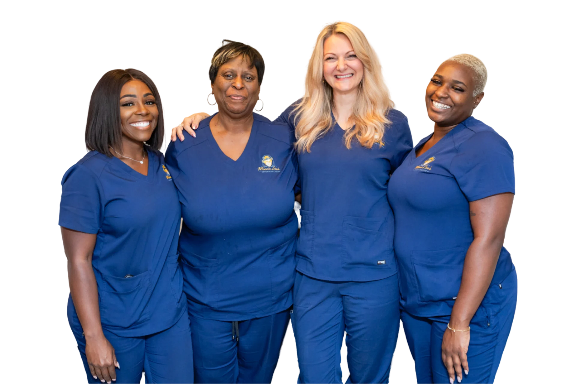 Four women in blue scrubs are posing for a picture.