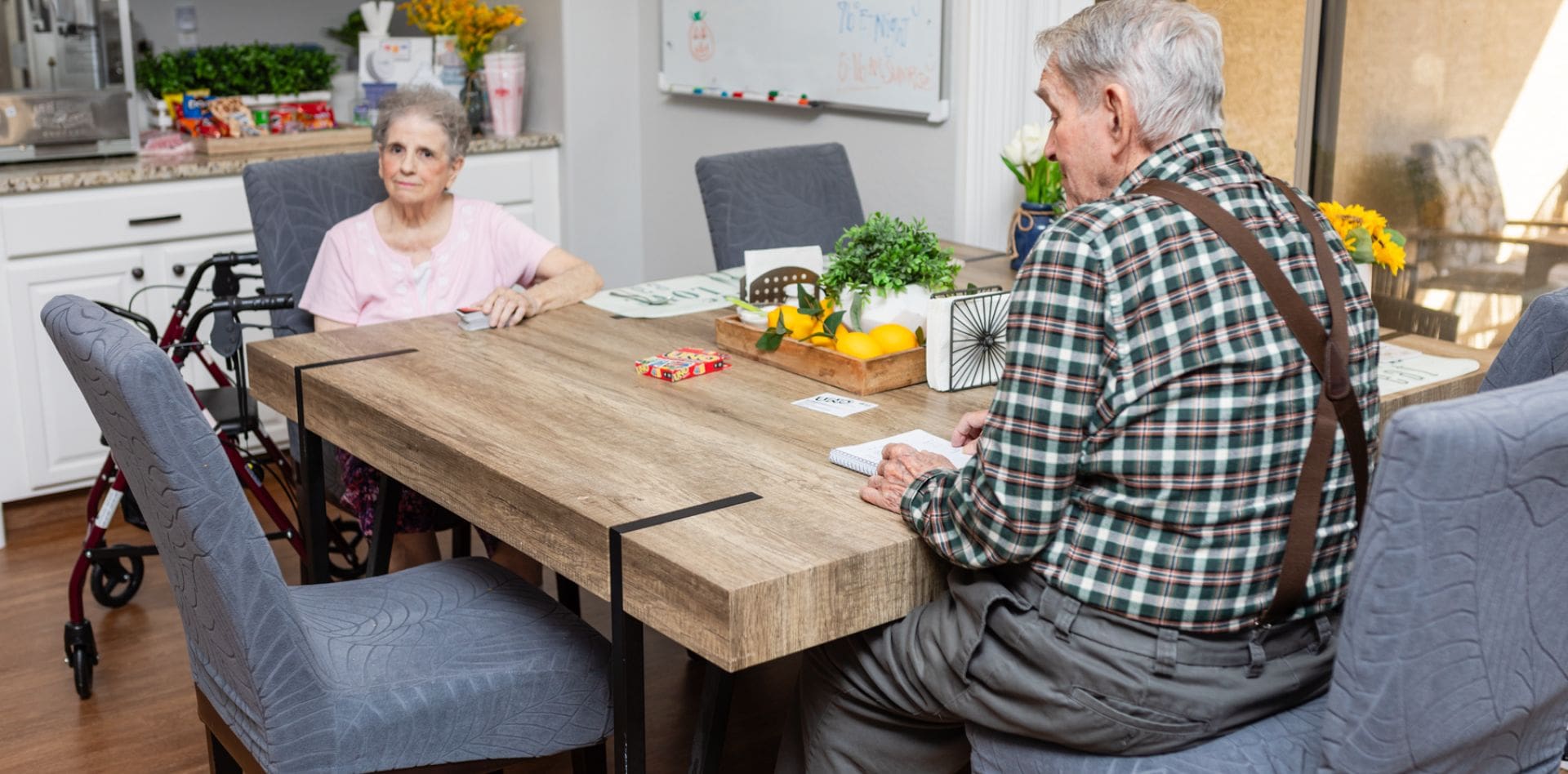 A man and woman sitting at a table.