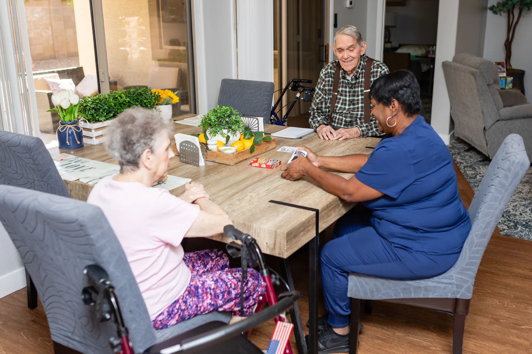 A group of people sitting around a table.